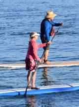 couple on standup paddle boards.